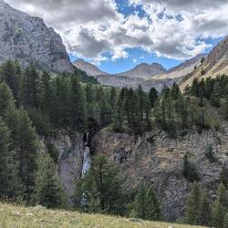 Waterfall with the Col de la Cayolle