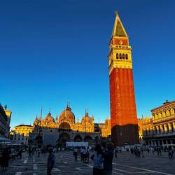 The day's last rays of sun on the Campanile in Piazza San Marcos.