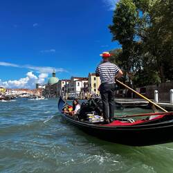 One of the about 400 gondoliers working the waters in Venice.
