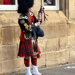 Bag pipe player