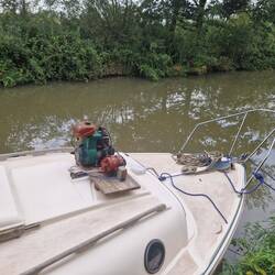 A clever boater has made a generator out of an old outboard engine and an alternator.
