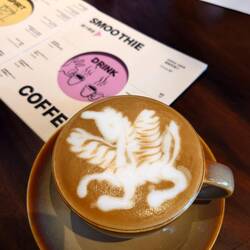 A coffee but dragon instead of cafe Nero stuff