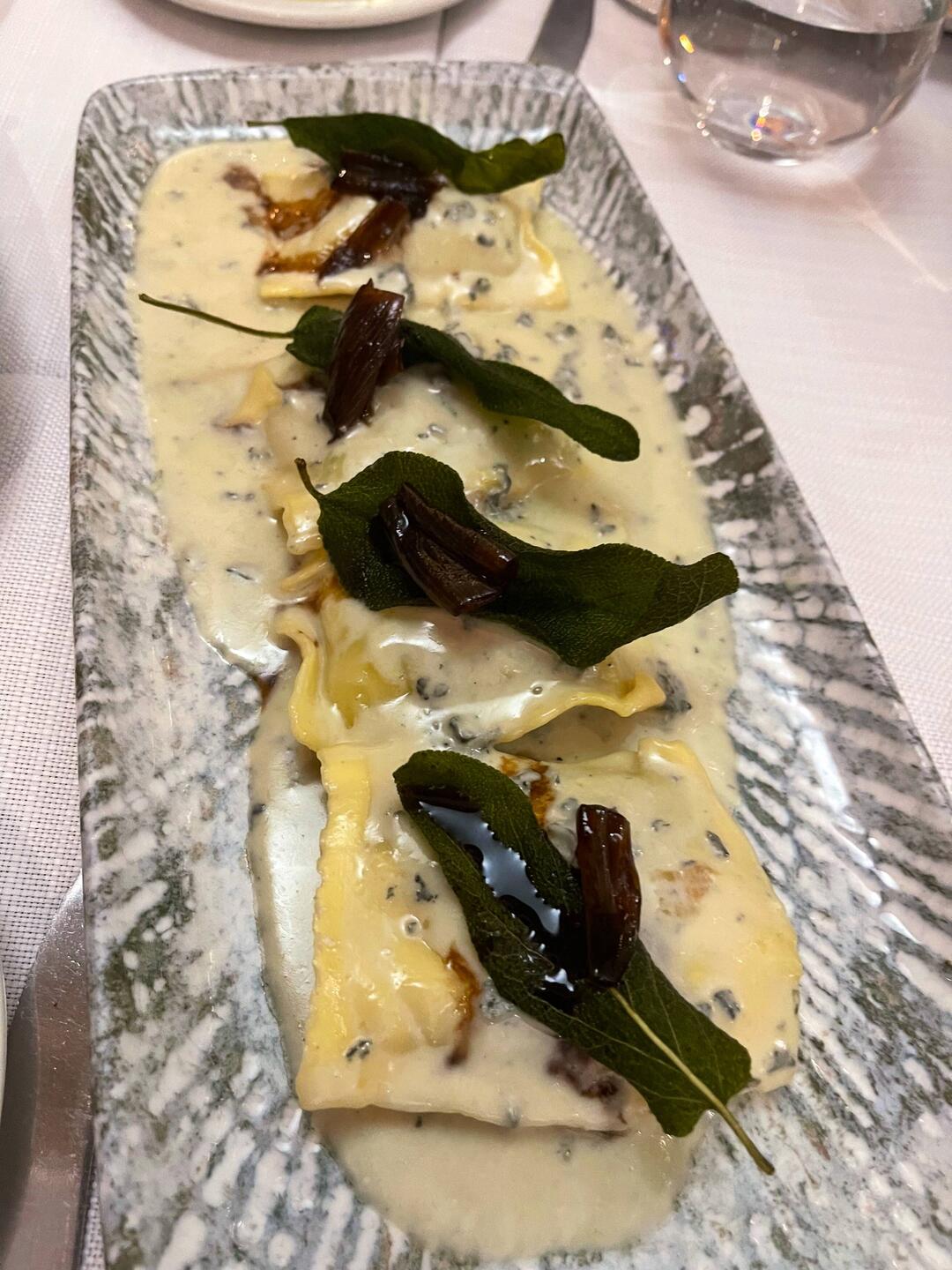 Cheese ravioli with blue cheese sauce