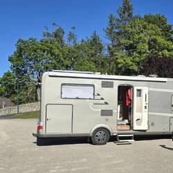 A large flat motorhome area overlooking the village