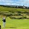 Great form on a bump and run by Celeste with the village of Castlerock in the background