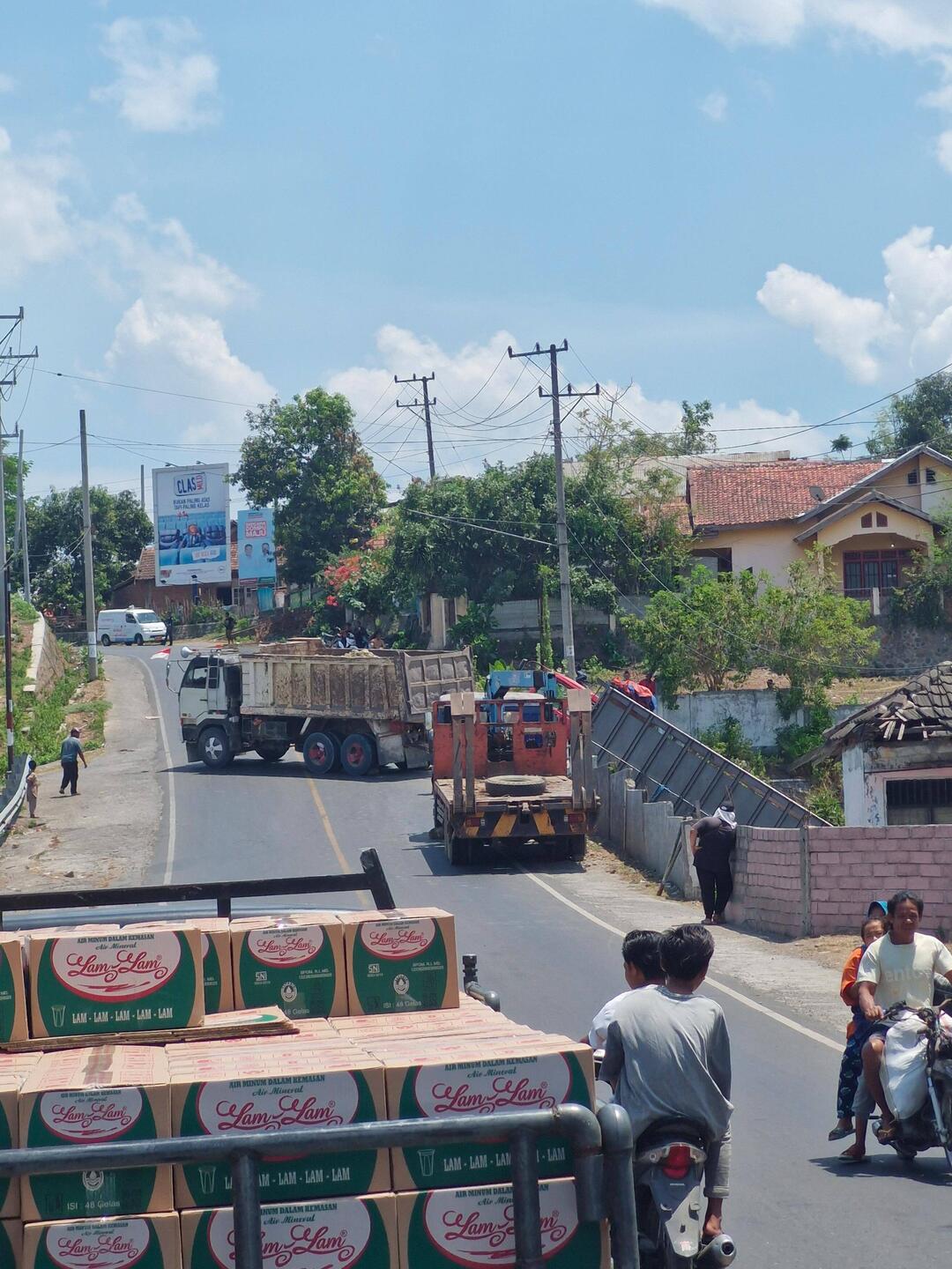 Traffic held up, truck off the side of the road