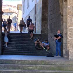 Bag pipes play welcoming pilgrims