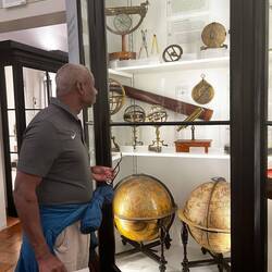 Admiring navigation instruments at the Civic Museum.