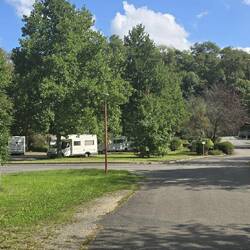 There aire is in lovely green space at the village centre next to the river