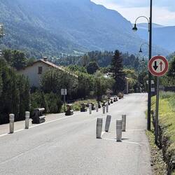 Your arrow is red so stop if somebody is coming the other way.