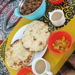 At the wedding, naan bread with cooked vegetables,milk tea, coated spicy roasted nuts