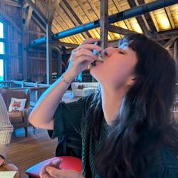 Stef eating an oyster to make a father proud