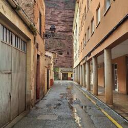 I'm not sure I would want to live in a little house at the bottom of a huge cliff.