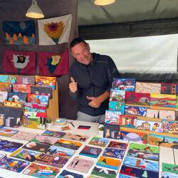 Artist with his hand made designs - Love my little coin purse