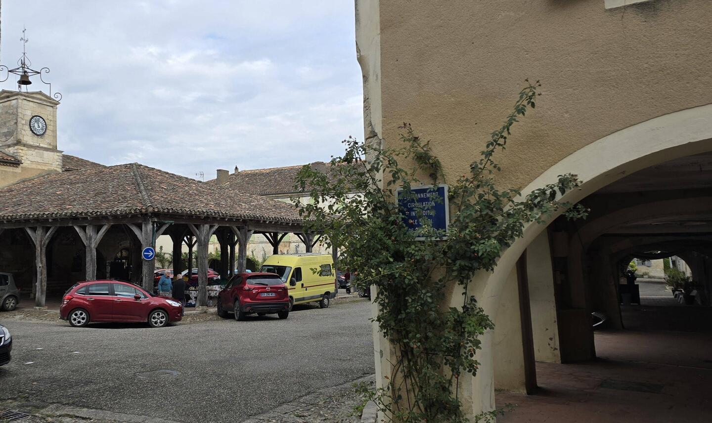Pretty market hall in centre of the village (Lots of cars though)