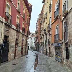 The yellow building on the right is definitely bowed.