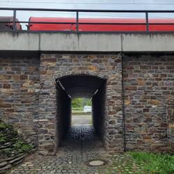 A tunnel under railroad connecting path from shoreline to city center