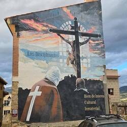 A religious mural on the side of a building