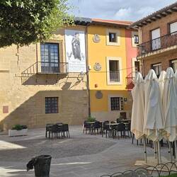 Colourful houses and cafés surround the central Plaza