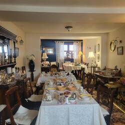 Breakfast room in our B,&B. This was before we were served a full breakfast. So much stuff.