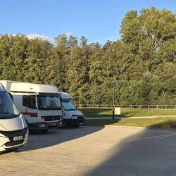 The free, small motorhome parkup is connected to the village by a footbridge and has all services