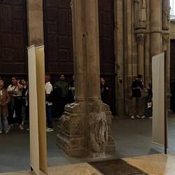 At the foot of the rear of the centre column, is a figure known as 'Santo dos croques'