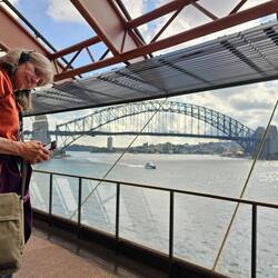 A view of the Sydney Bridge from inside the Opera House.