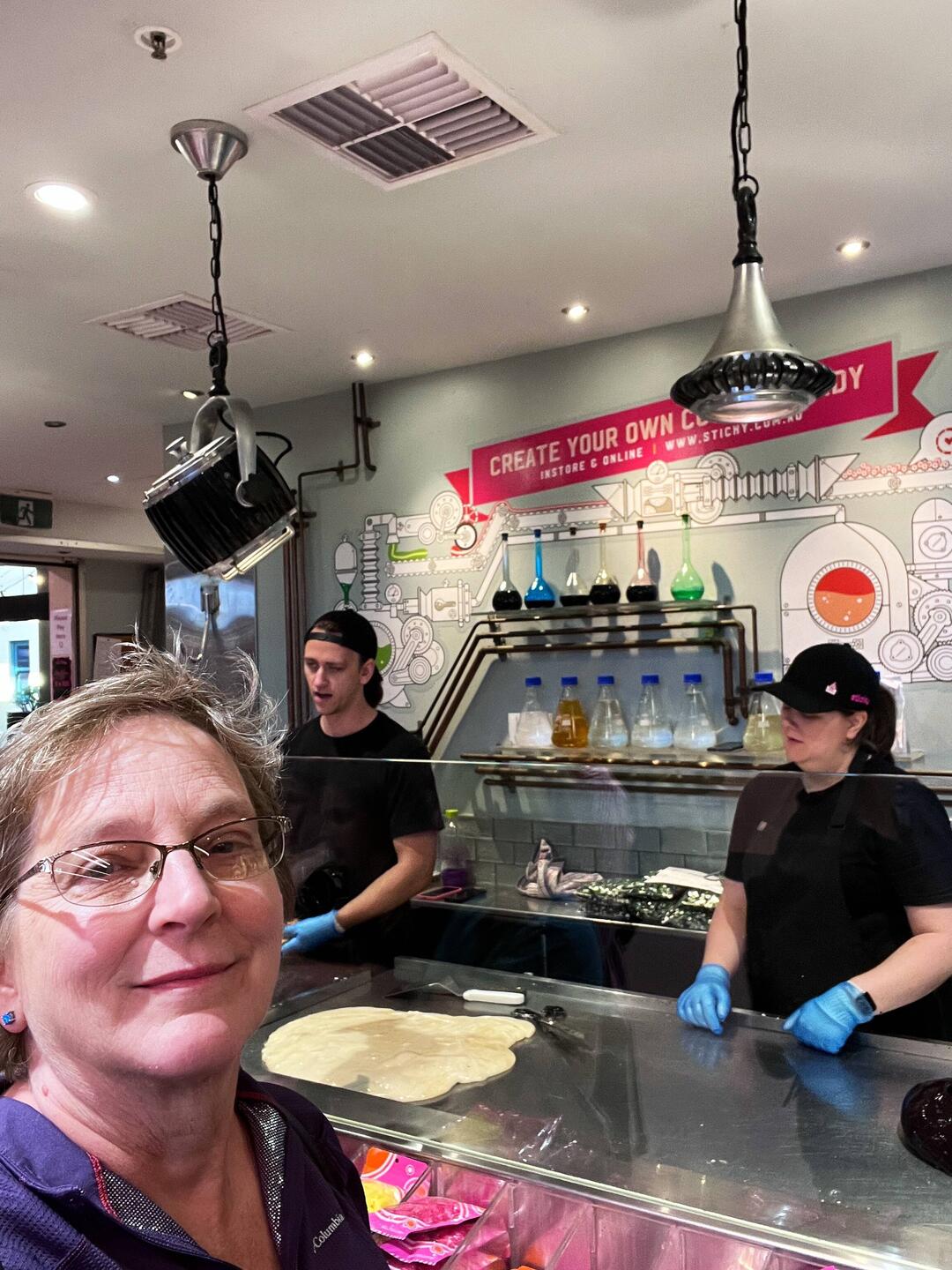 The table is warm but not hot. The white glob is the very hot candy