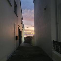 View of the water from an alley on main street