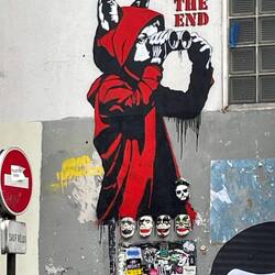 Red Riding Hood with ceramic heads of KISS beneath her