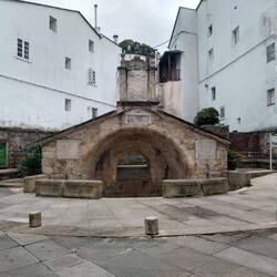 A water fountain across from the cathedral.