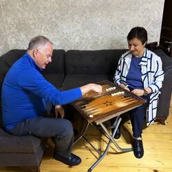 Before the meal, Tea teaches Mark a new game