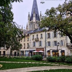 Our apartment is above the red signage