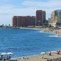 On the beach, our hotel in the distance.