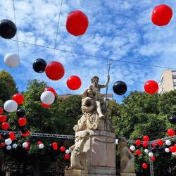 Not sure why the balloons are there, maybe to do with the food truck festival.