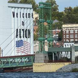 The green ramp under welcome mural leads to casino.