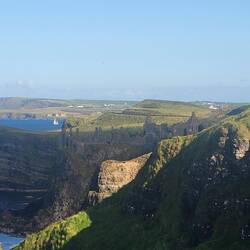 Dunluce Castle looking east. We watched the sailboat and we're surprised to get it in the shot.