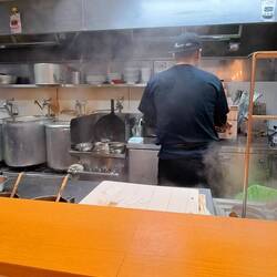 Chef making our ramen, gyoza and rice