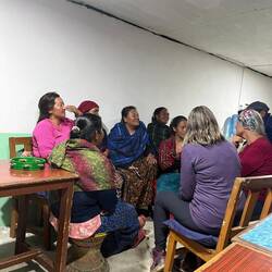 Jen and I asking about their role in the community & presenting a donation