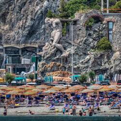 Il Gigante statue is located at the end of Fegina beach.