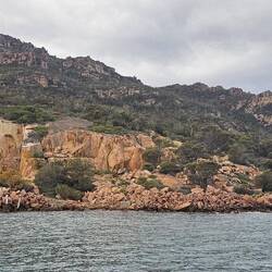 Old granite quarry with kayakers braving the chilly/windy conditions.