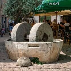 Traditional olive crusher