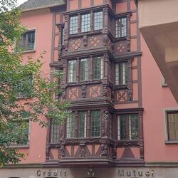 Beautiful bay windows saved from a bombed house and added to this one.