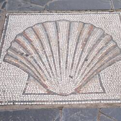 A mosaic pavement Camino sign.