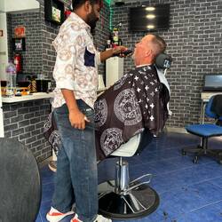 Hair cut, beard trim, ear, nostril and eyebrow tidy up.