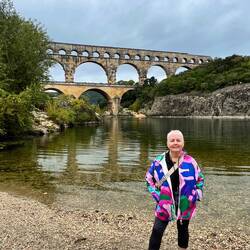 Danielle down at the rivers edge with Pont du Gard