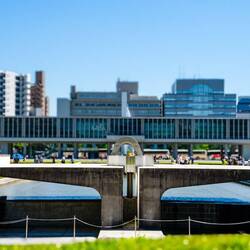 Peace flame with Peace museum in the background