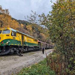 The White Pass and Yukon Railway from the outside. The Brakeman (lady) is switching the tracks.