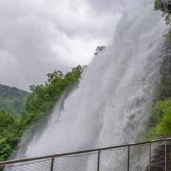 Walking under Steinsdalsfossen waterfall.