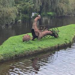Dragon sculpture in the river Dronne